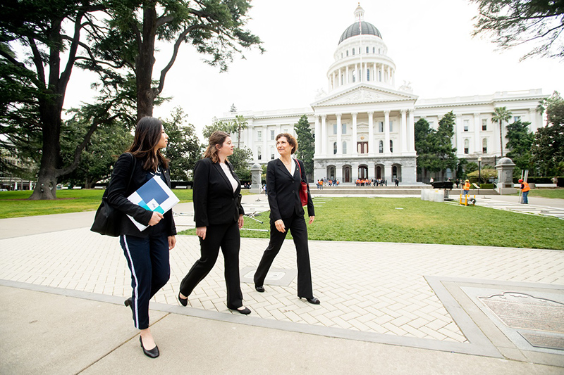 women walking in front of State Capitol Building Sacramento